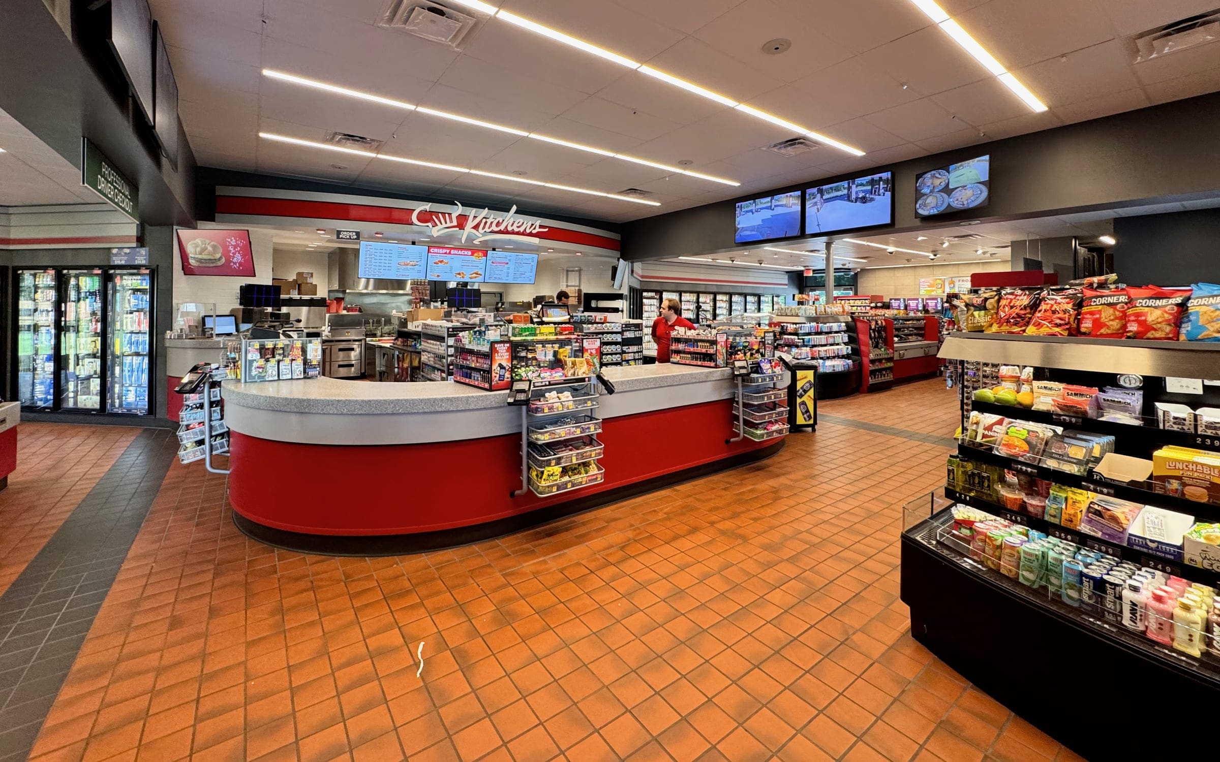 The checkout counter of a neighborhood convenience store.